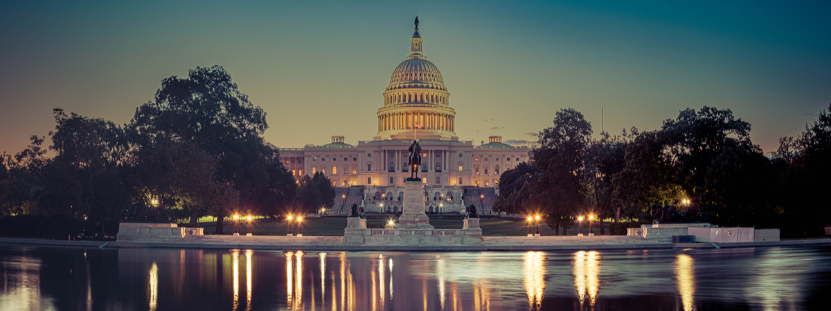Panoramic image of the Capitol of the United States with the capitol reflecting pool in morning light.